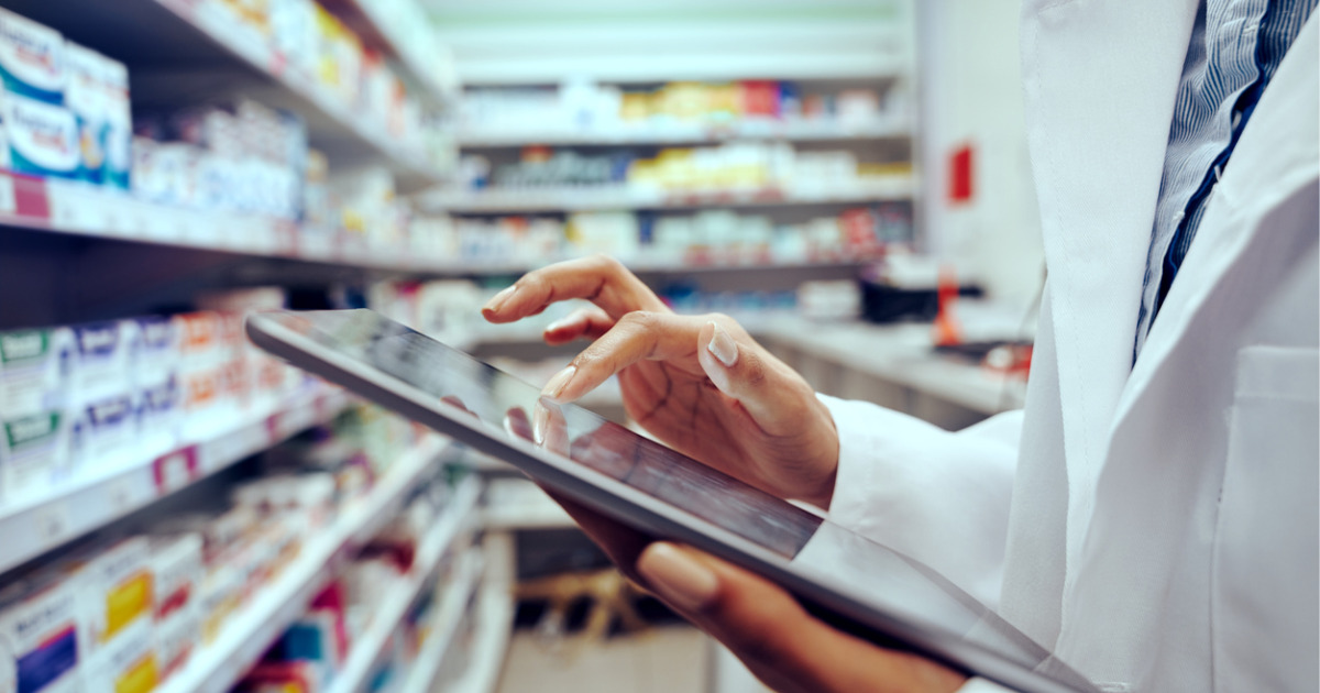 Closeup of hands of a pharmacist doing inventory