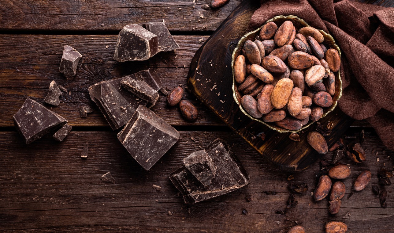 cocoa beans, chocolate on wooden background
