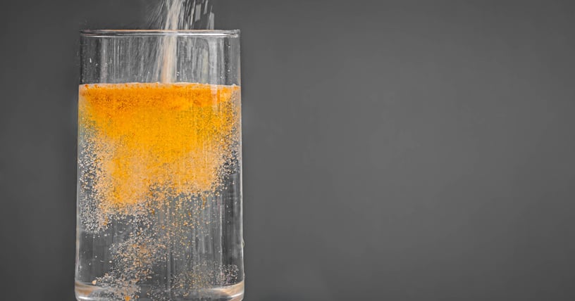 energy powder in glass of water